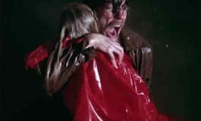 John Baxter holding the drowned Christine
